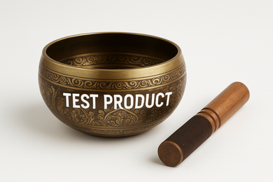 A hand-painted metal Tibetan singing bowl set, placed neatly with a wooden stick mallet beside it. The bowl has intricate decorative patterns, and a clear label “TEST PRODUCT” is prominently written across the bowl in bold white letters. The background is plain white with soft shadows, product-centered and well-lit, like a professional e-commerce product photo.